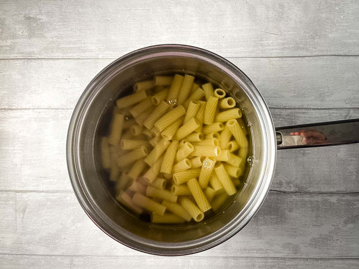 rigatoni cooking in a pan.