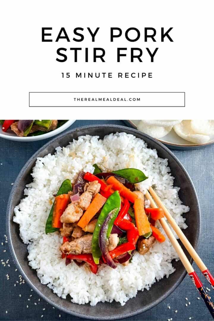 pork stir fry served in a bowl with rice.