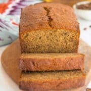 slices of banana bread with espresso on a board.