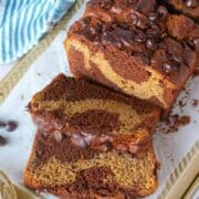 sliced marbled peanut butter chocolate banana bread showing inside of loaf.