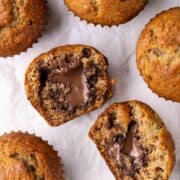 nutella banana muffin in half showing chocolate middle surrounded by other muffins.