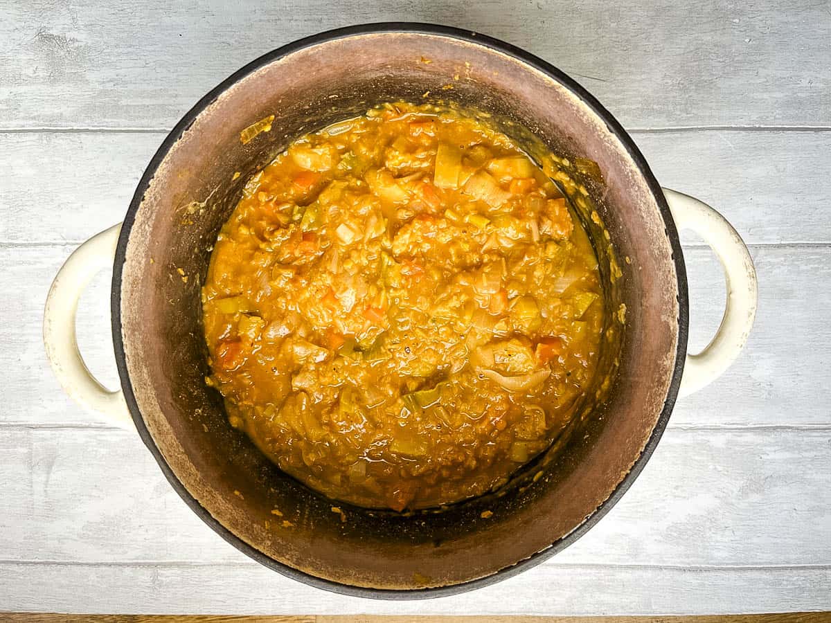 leek and red lentil soup simmered in pan.