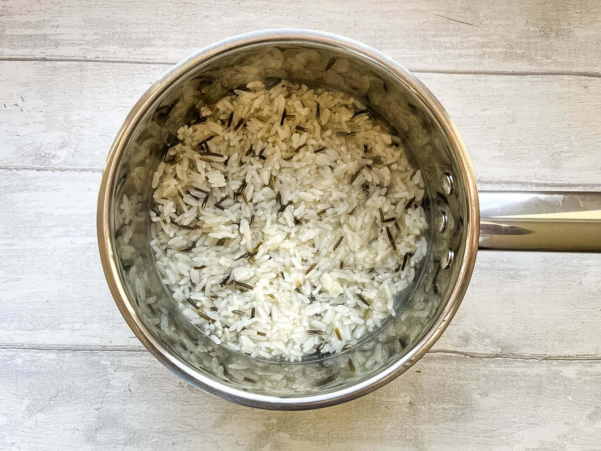 wild rice cooking in a pan.