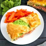 salmon en croute on plate with carrot