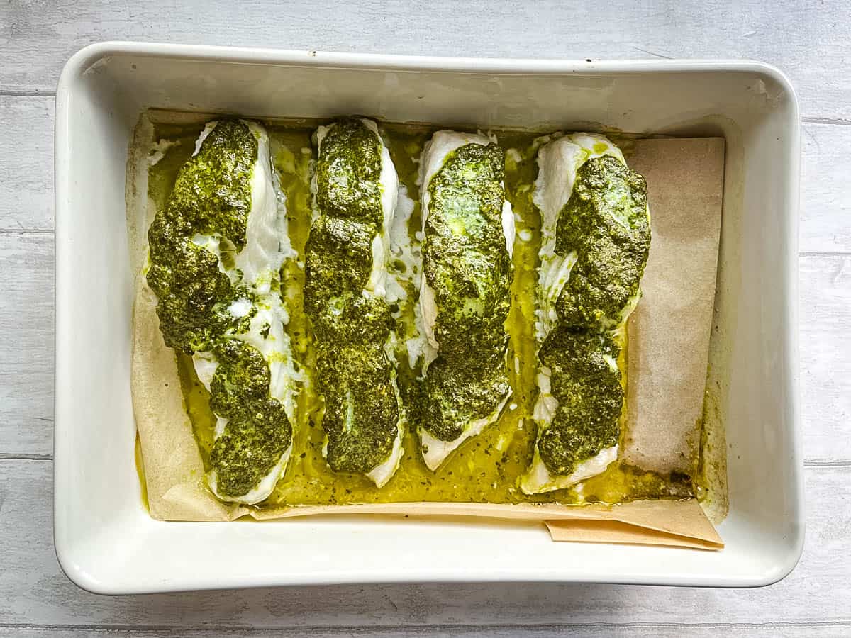 tray baked cod with green pesto baked in oven