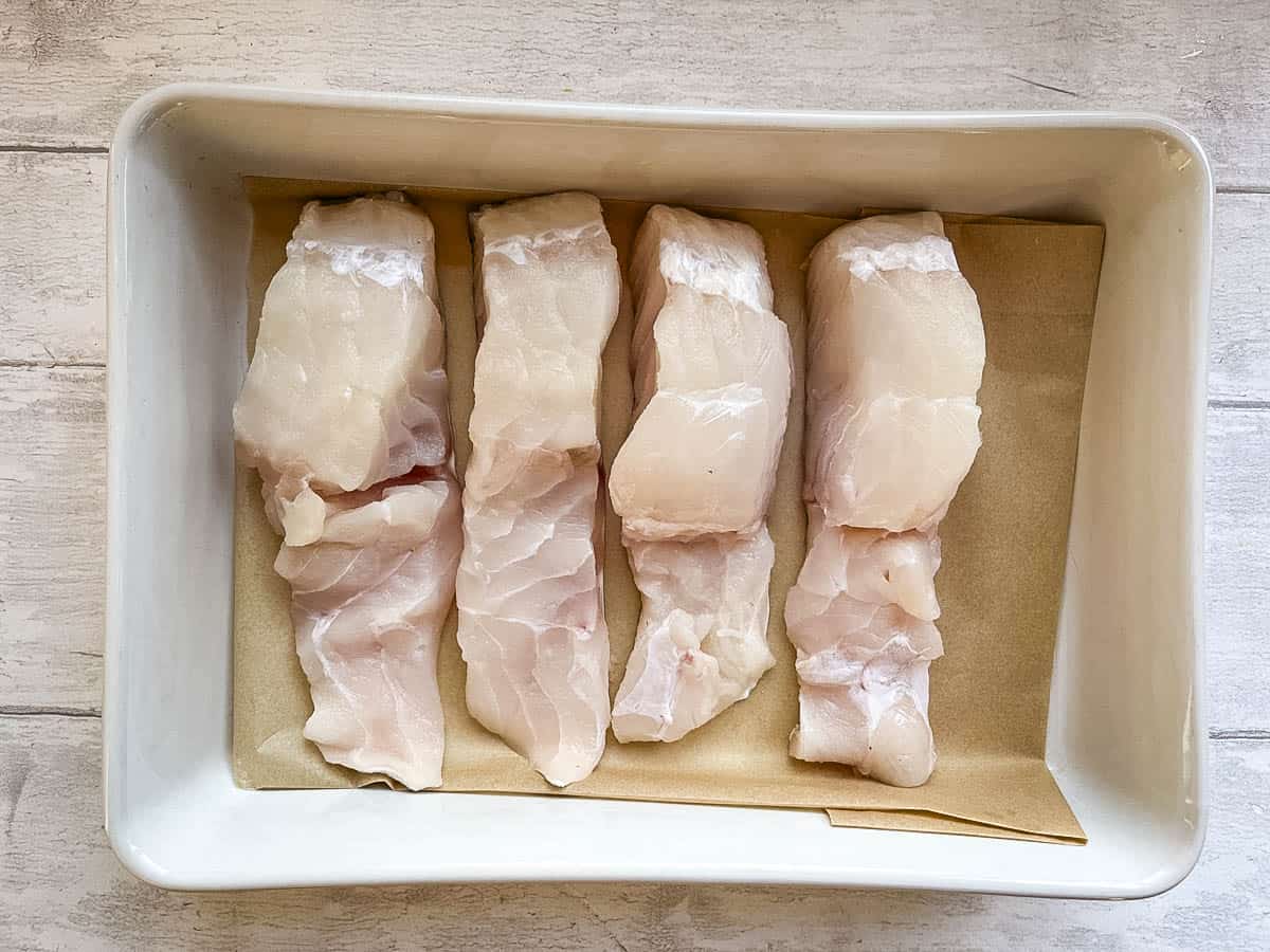 cod loins in baking dish ready.