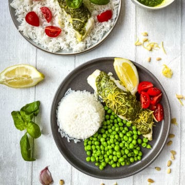 baked cod and pesto served with rice and tomatoes