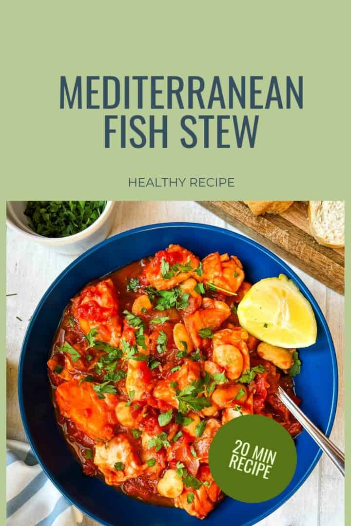 bowl of white fish stew with butter beans topped with fresh parsley.