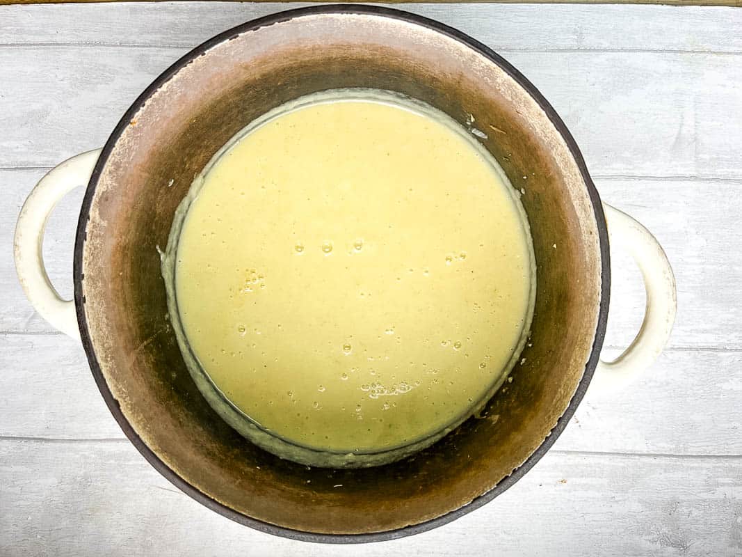 stilton and celery soup blended together in pan.