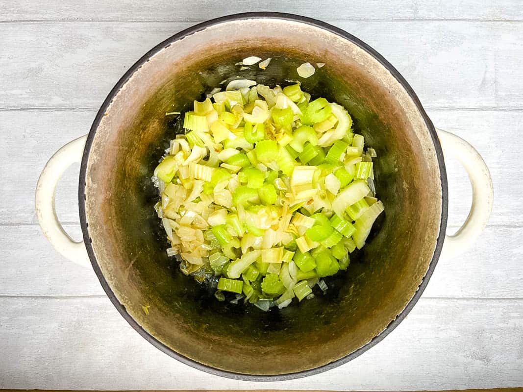 diced celery and onion frying in pan.