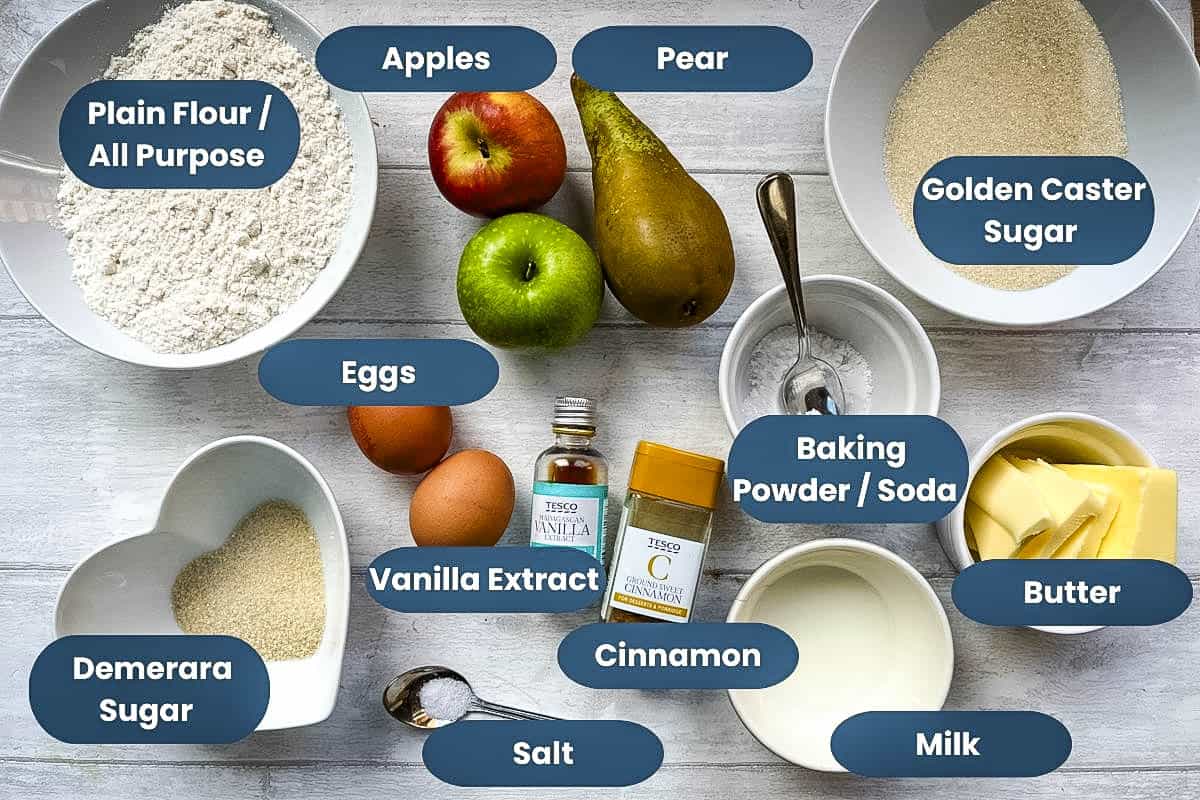 ingredients for apple and pear cake. plain flour, apples, pears, golden caster sugar, eggs, vanilla extract, cinnamon, baking powder, butter, demerara sugar, salt, milk.
