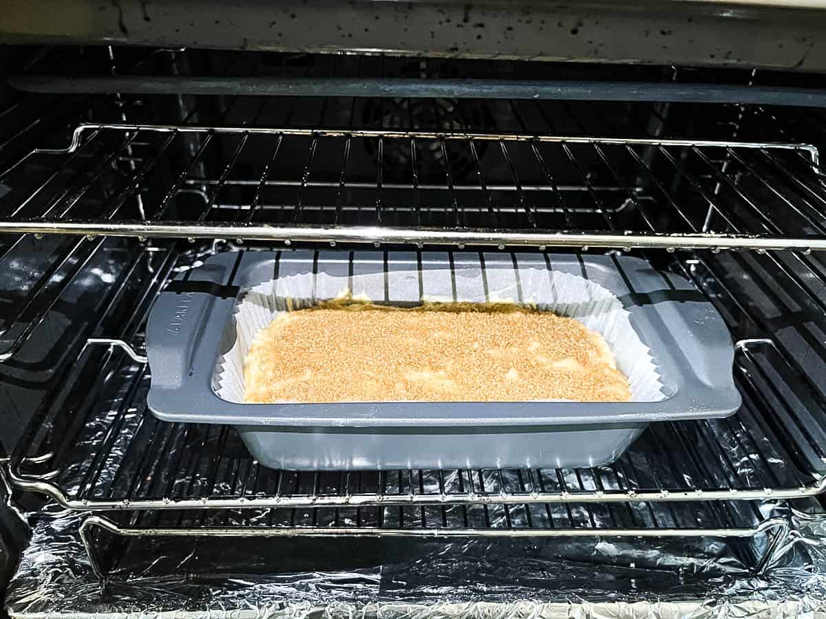 apple and pear cake on lower shelf of oven ready to be cooked.