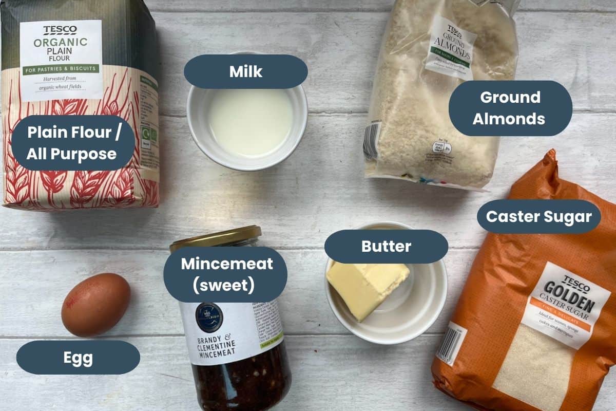 ingredients for homemade mince pies, flour, milk, ground almonds, caster sugar, egg, sweet mincemeat, butter.