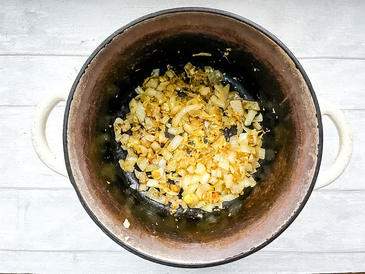 diced onion crushed garlic and minced ginger in pan.