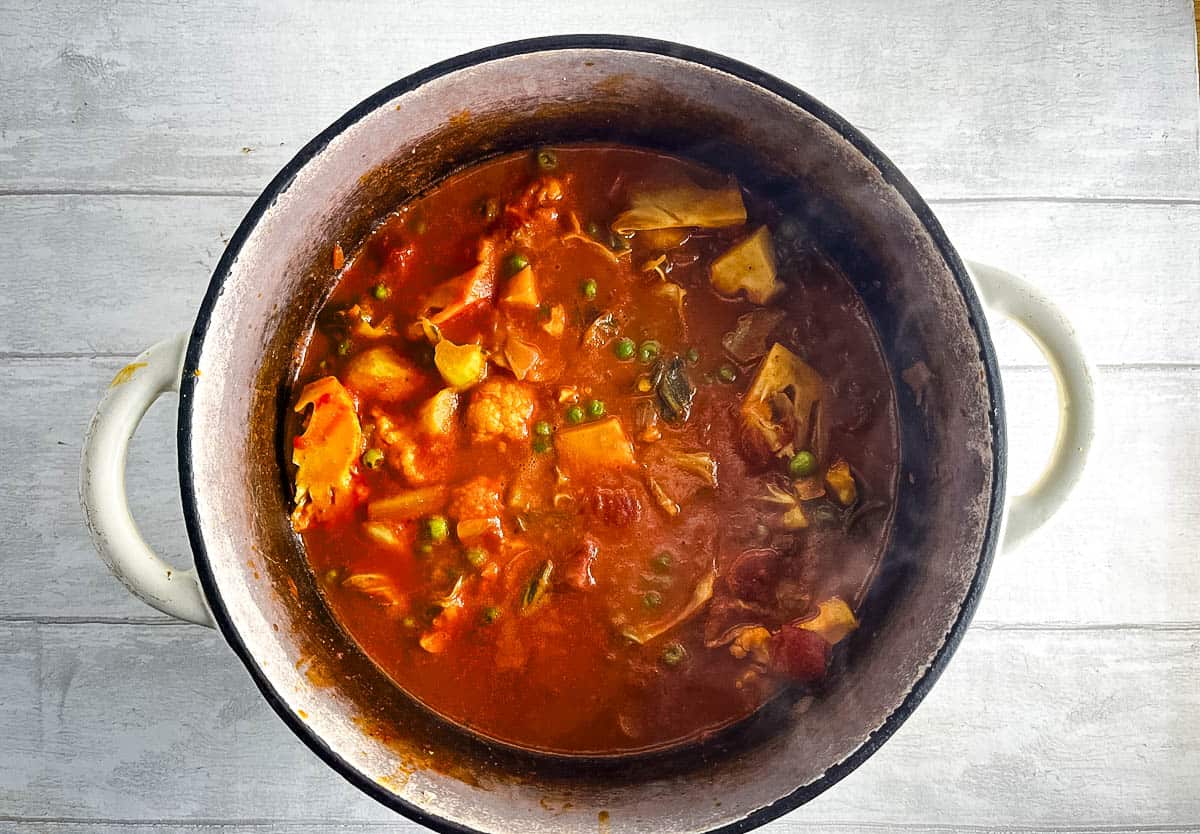 peas added to cauliflower curry.