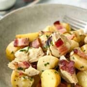 bowl of potato salad with artichoke and panchetta.