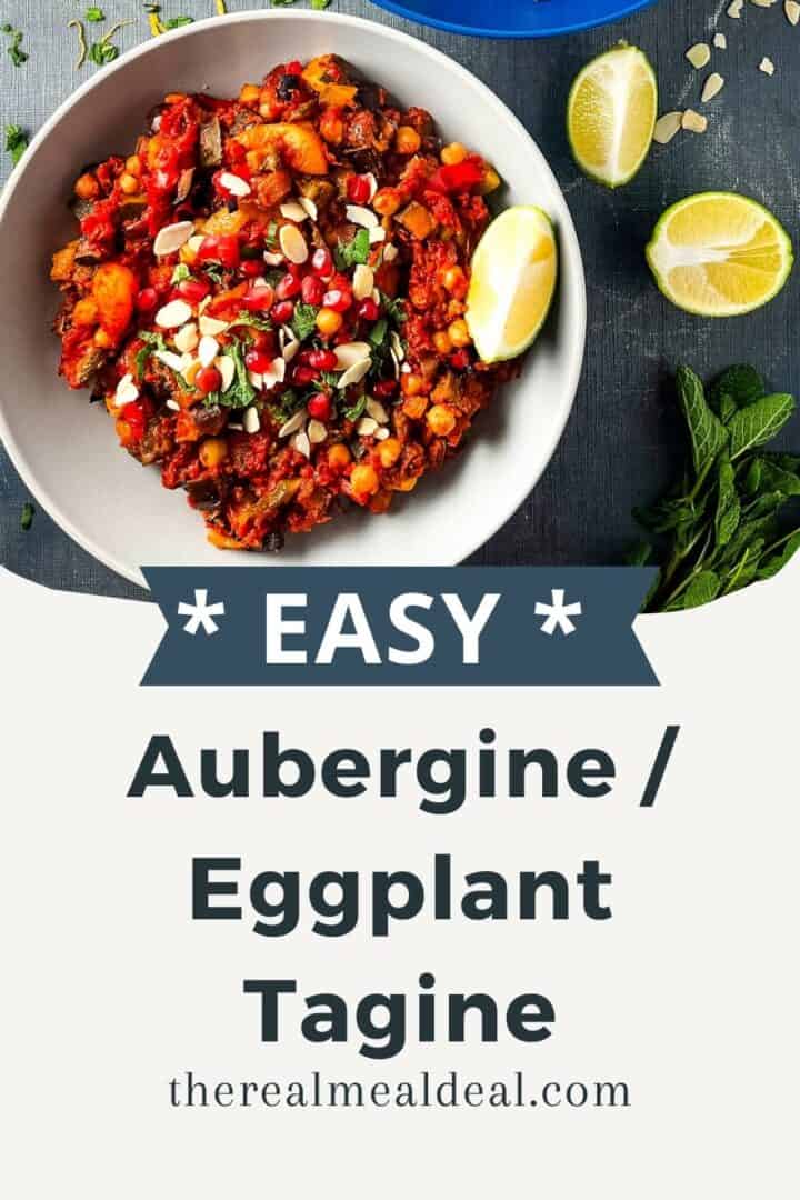 bowl of aubergine tagine topped with fresh mint and flakes almonds served with a wedge of lime.