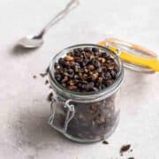 glass jar of roasted black beans
