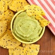 bowl of avocado dip with tortilla chips.
