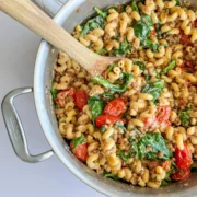 bowl of tomato and feta lentil pasta