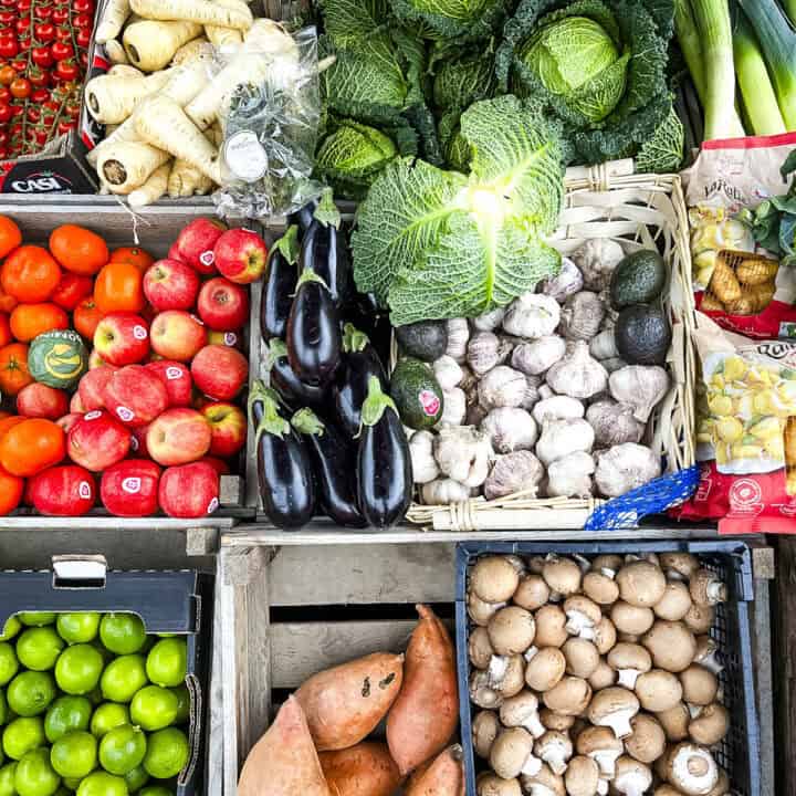 assortment of vegetables in crates at a greengrocers