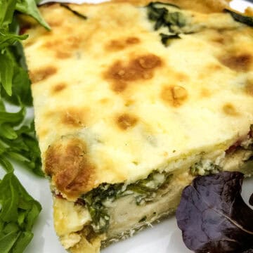 slice of quiche with spinach filling