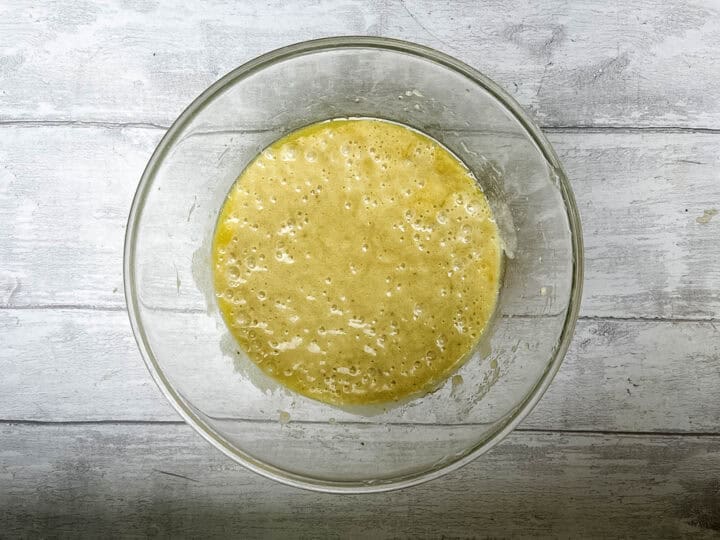 bananas, butter and egg blended together in bowl.