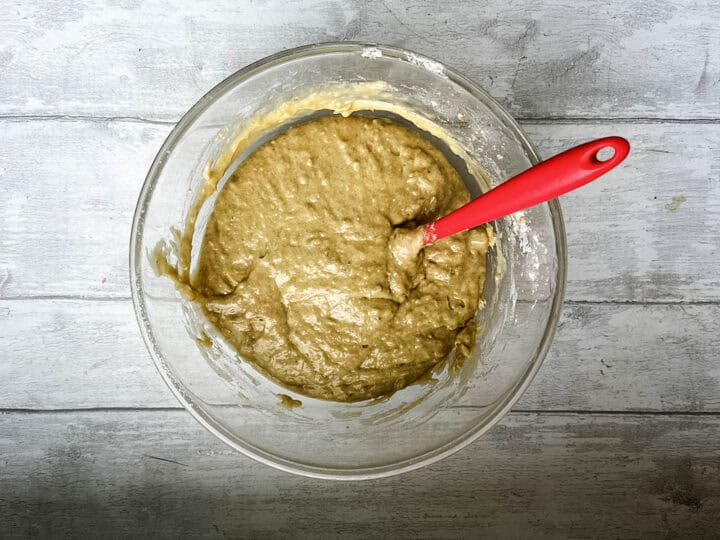flour folded into banana egg and butter mixture for banana and cinnamon muffins.