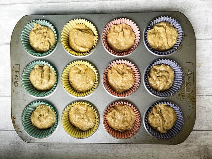 banana and cinnamon muffin mixture in muffin cases.