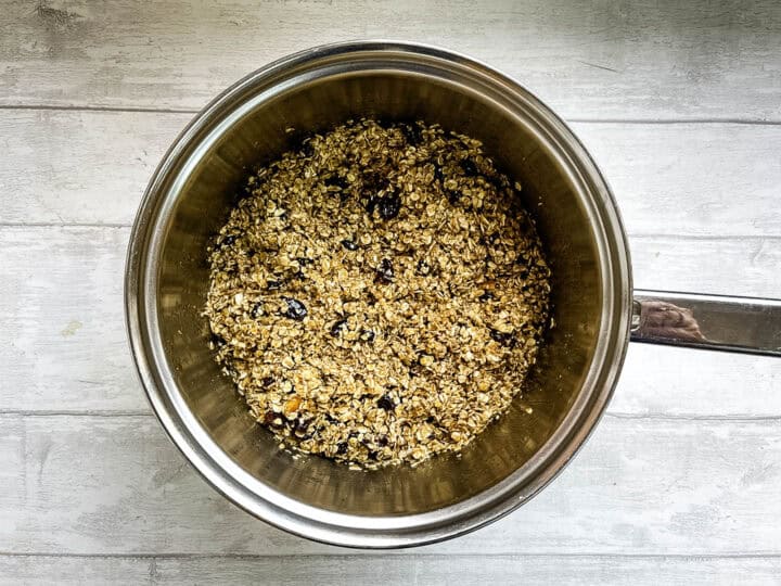 fruit flapjacks oats, dried mixed fruit, sugar, syrup and butter mixed together in pan.