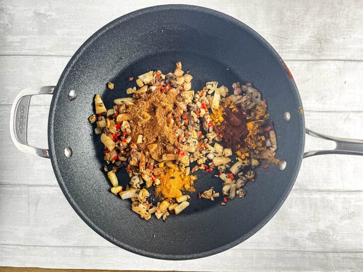 curry powder tumeric and chilli powder added to onion, chilli and cumin seeds.