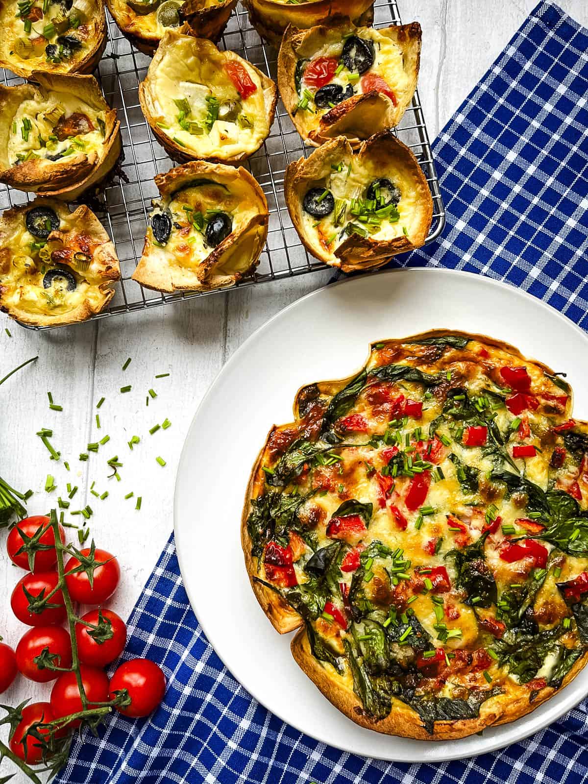 baked tortilla quiche and mini tortilla quiches on a cooling rack