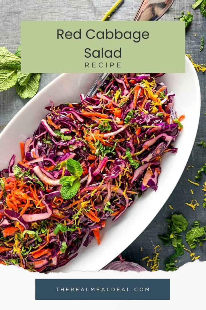 red cabbage salad with carrot and mint topped with lemon zest.
