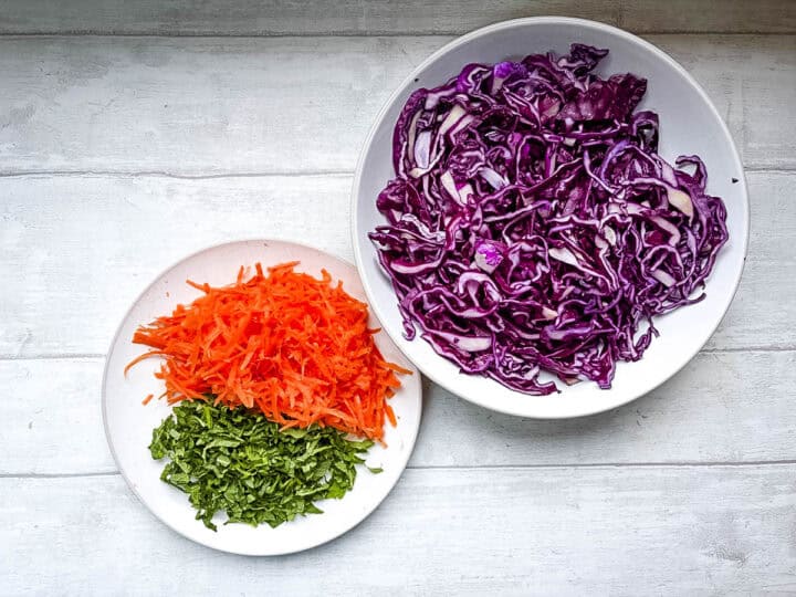 sliced red cabbage, grated carrot and chopped mint ready for red cabbage salad