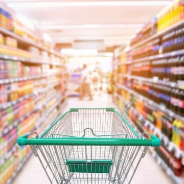 shopping trolley in supermarket showing how to shop sustainably for food ingredients.
