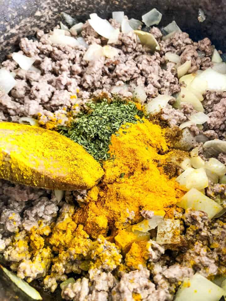 spices added to lamb mince and onions