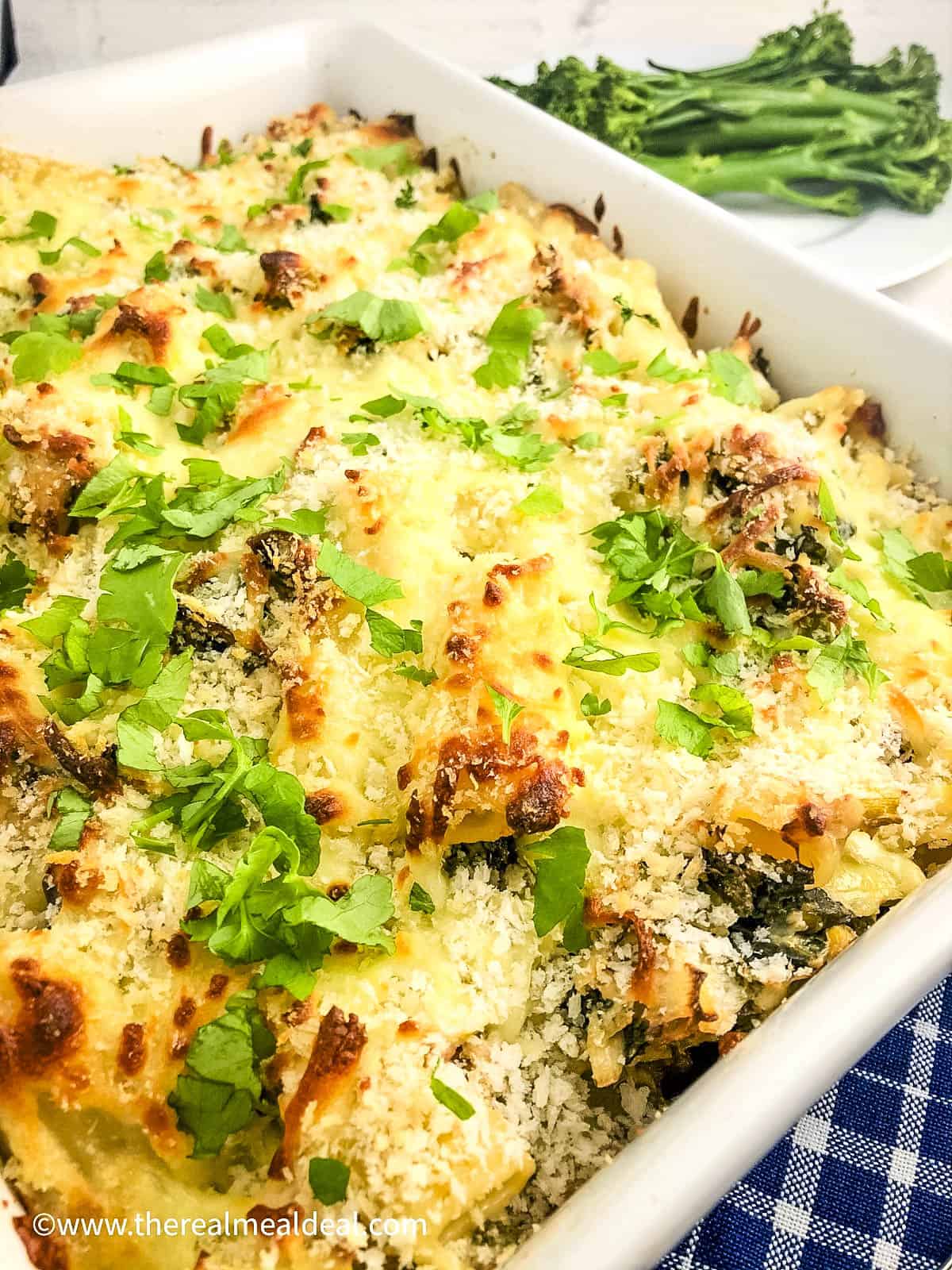 smoked mackerel pasta baked and topped with parsley.