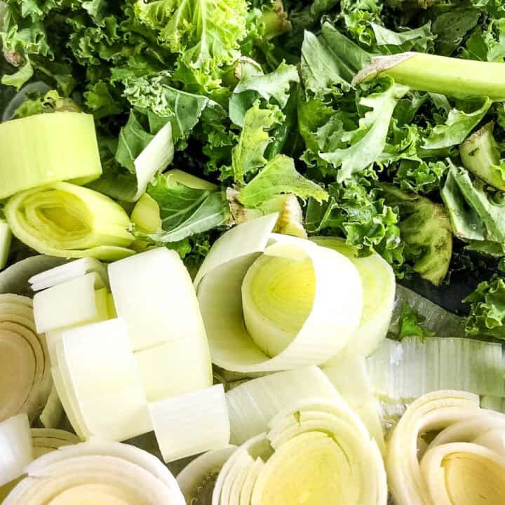diced leeks and kale in pan.