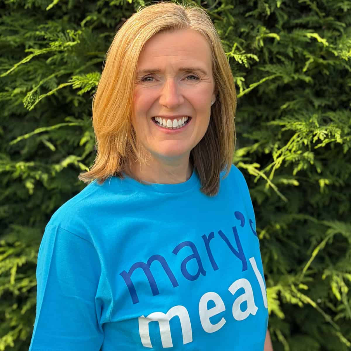 claire carter founder of the real meal deal in a Mary's Meals t-shirt as sign of corporate sponsorship