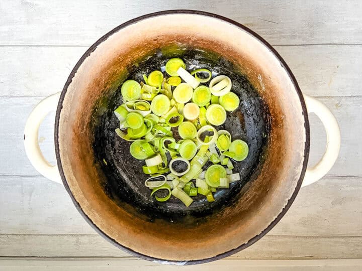 diced leeks frying in pan