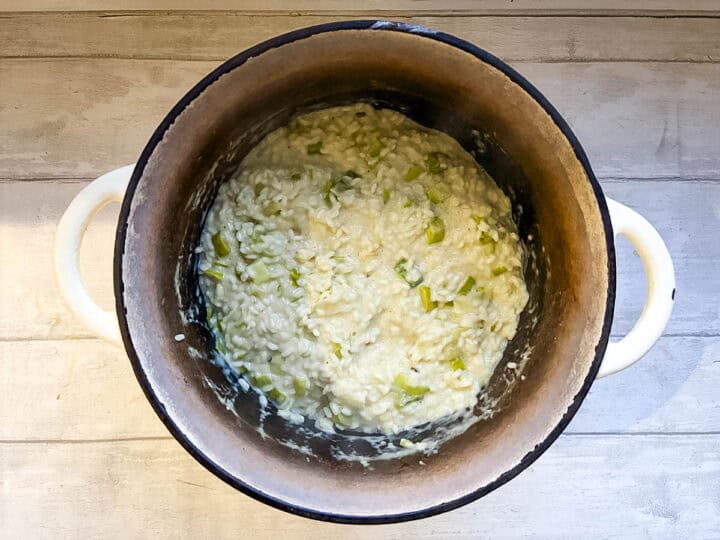 milk and stock stirred into risotto rice with leeks