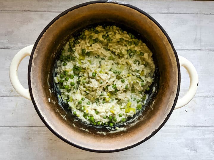 peas stirred into risotto rice with leeks